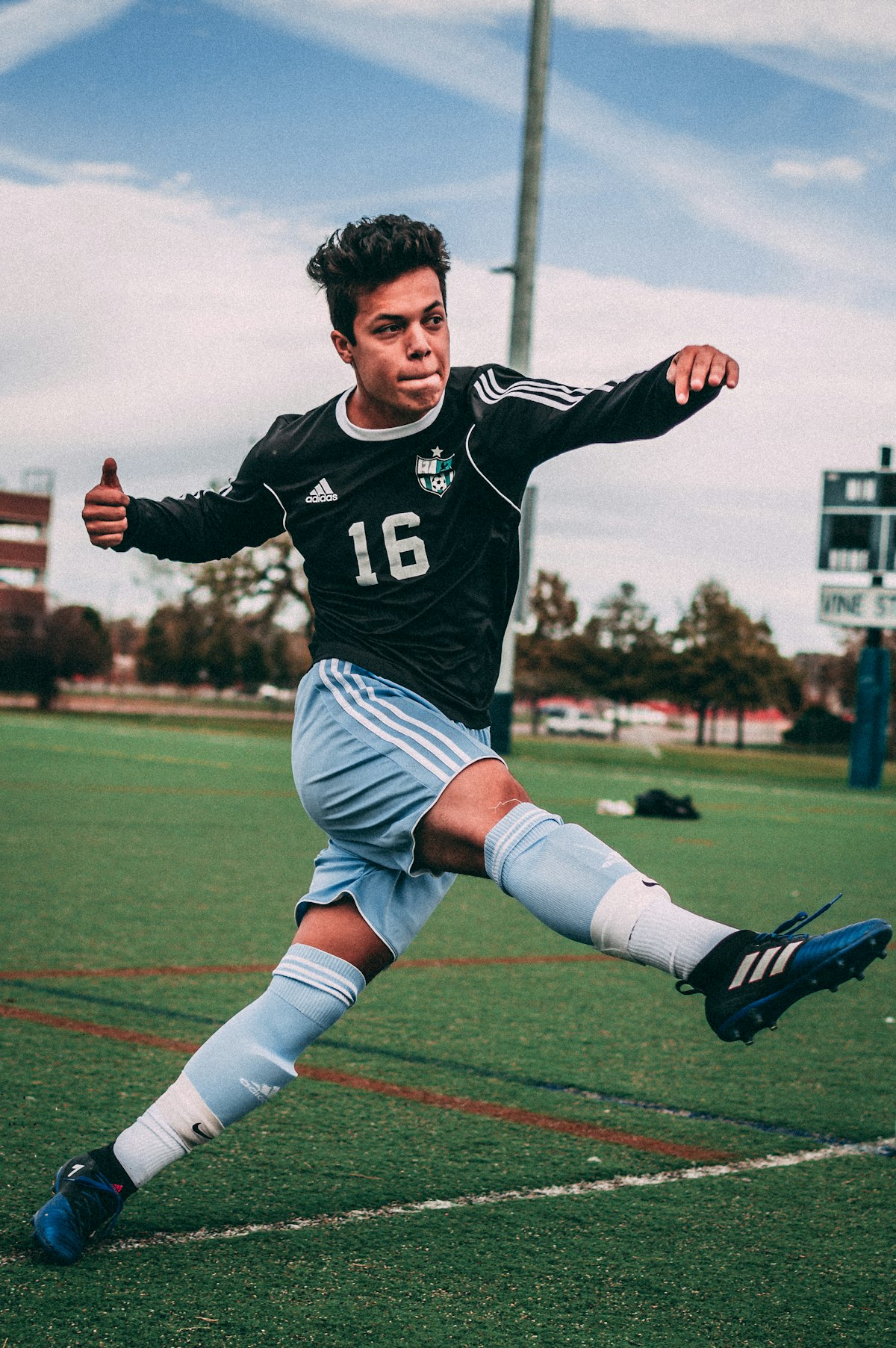 Youth athlete competing in a black training kit